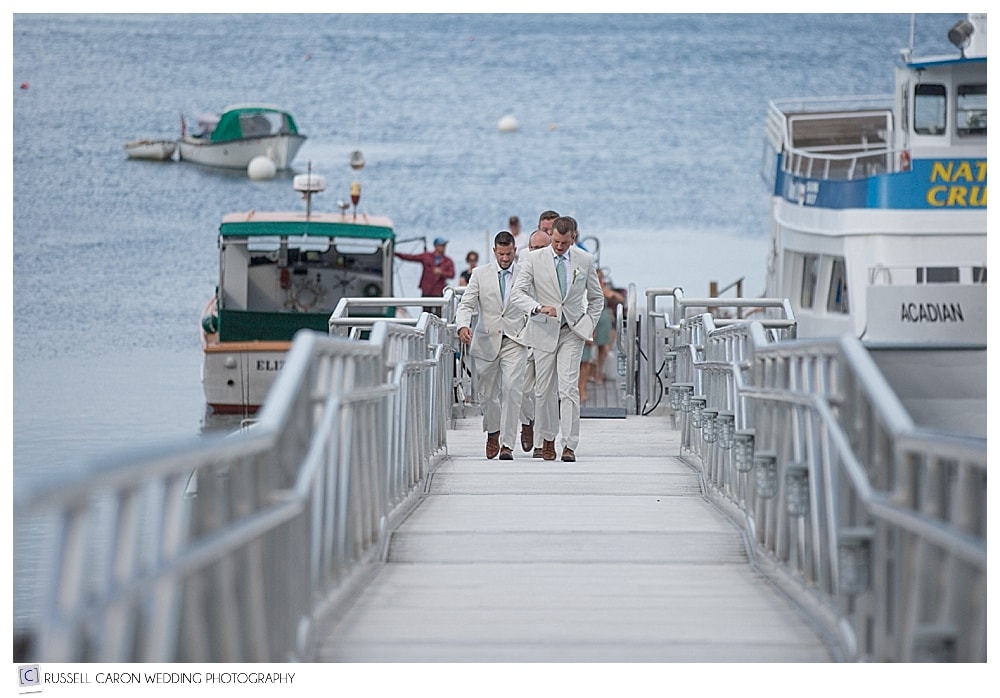 groomsmen walking up dock in Bar Harbor Maine