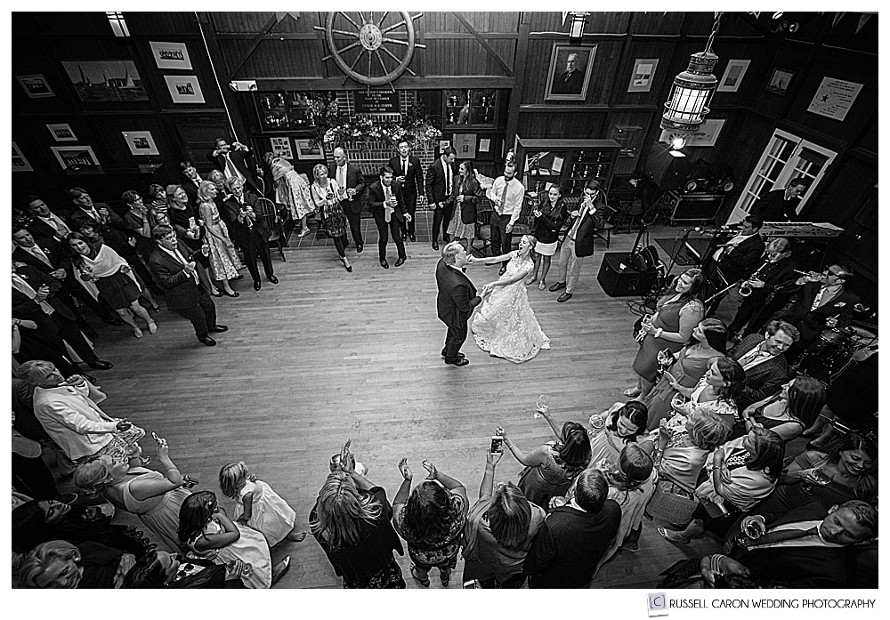 black and white photo of a bride and groom during their first dance at their cyc wedding dance party