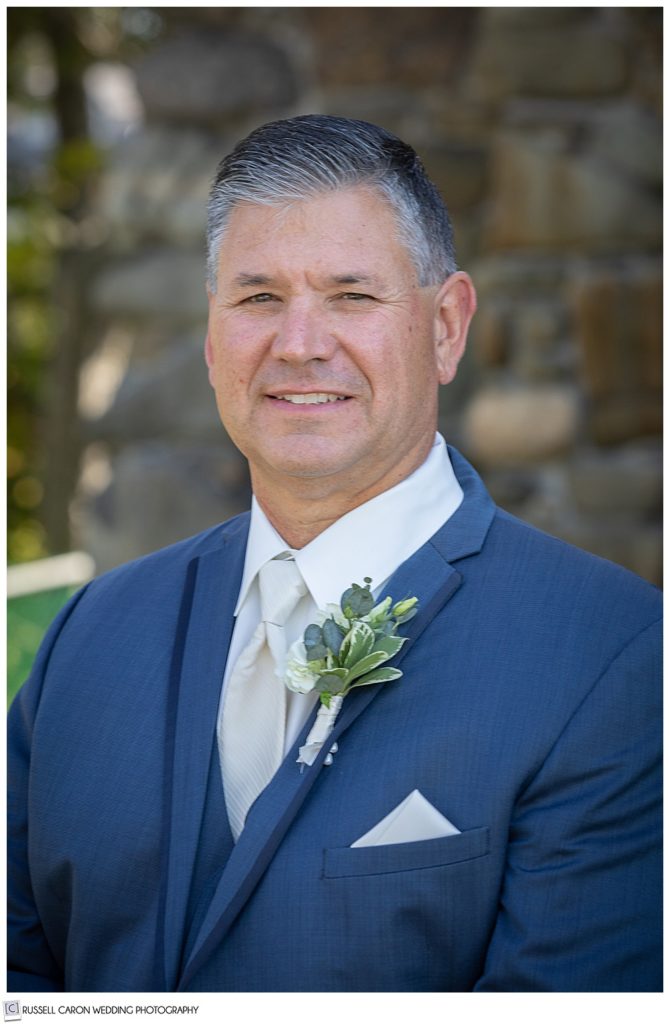 groom portrait of a man wearing a blue suite