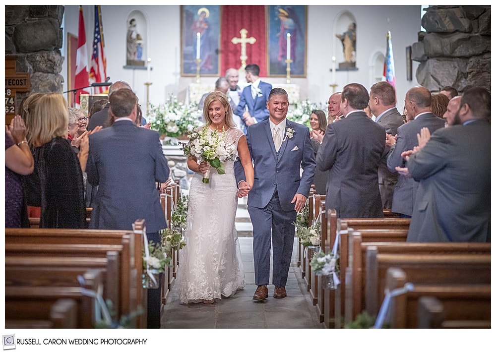 bride and groom during their wedding recessional at Saint Ann's Episcopal Church, Kennebunkport, Maine