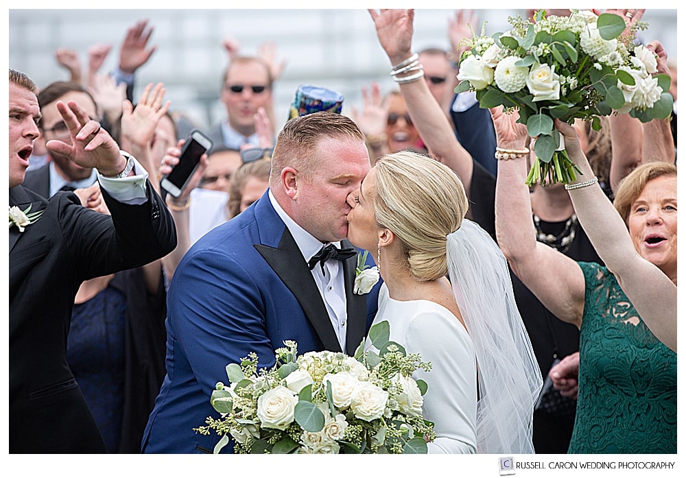 bride and groom have a celebratory wedding kiss at their Newagen Seaside Inn wedding