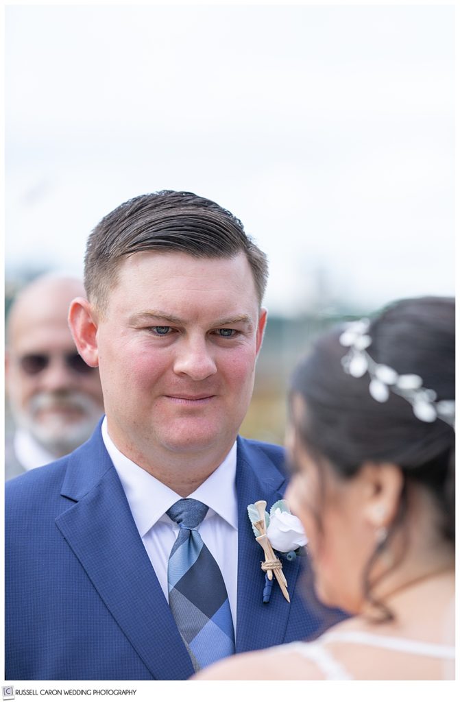 groom looking at this bride during their Edgecomb Maine wedding ceremony