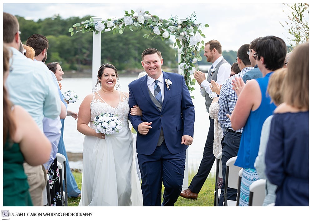 bride and groom during wedding recessional at their Edgecomb Maine wedding