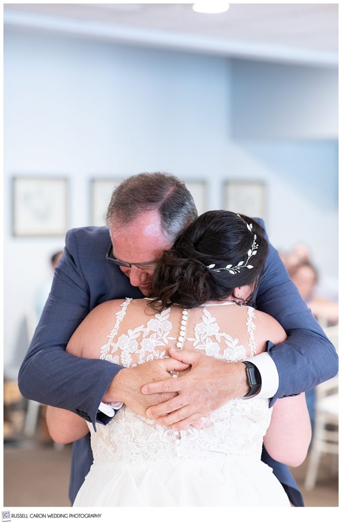 bride's dad hugging her after their father daughter dance