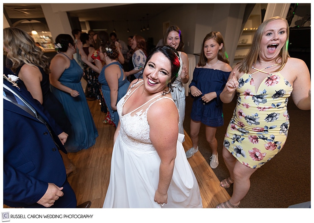 bride dancing with her friends  during her Edgecomb Maine wedding reception