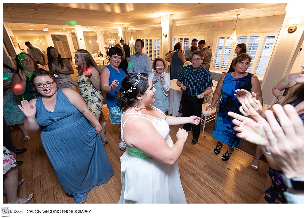 bride dancing with her friends at Sheepscot Harbour village Resort wedding