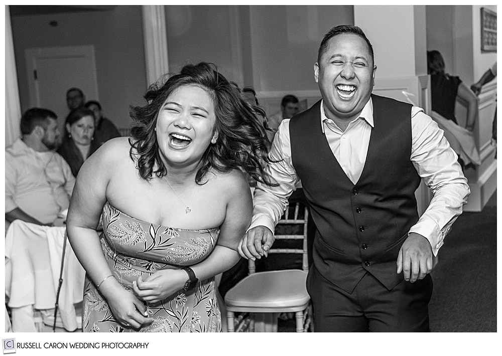 black and white photo of guests laughing