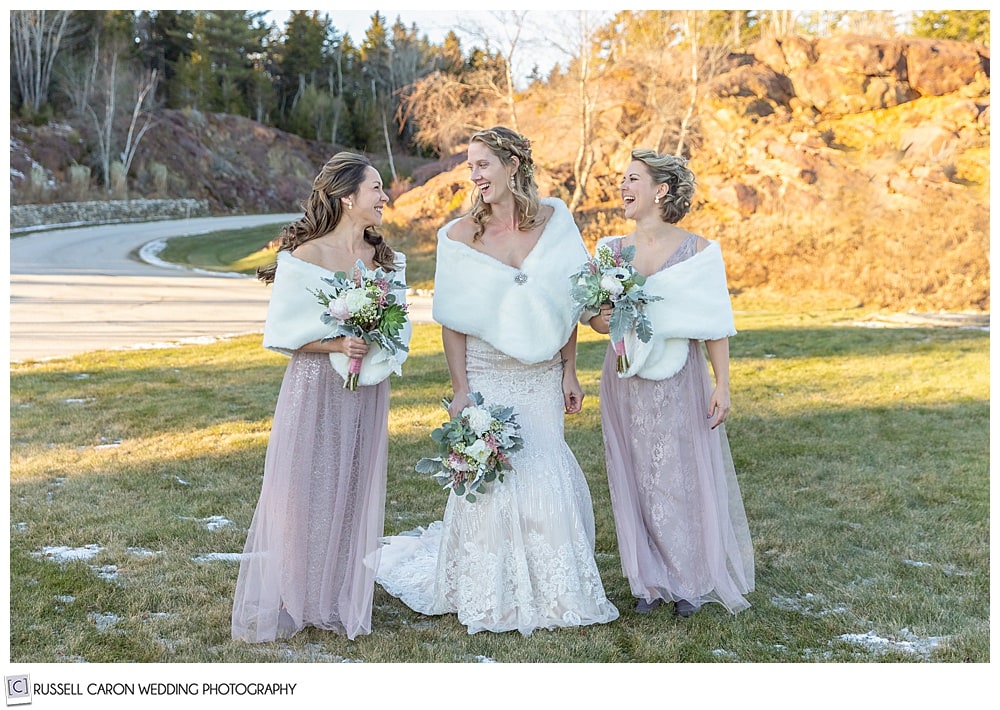 bride and two bridesmaids laughing