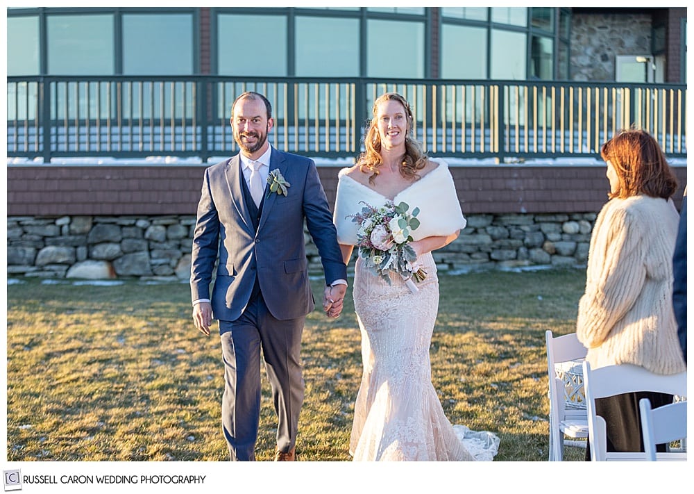 bride and groom during processional of their wedding