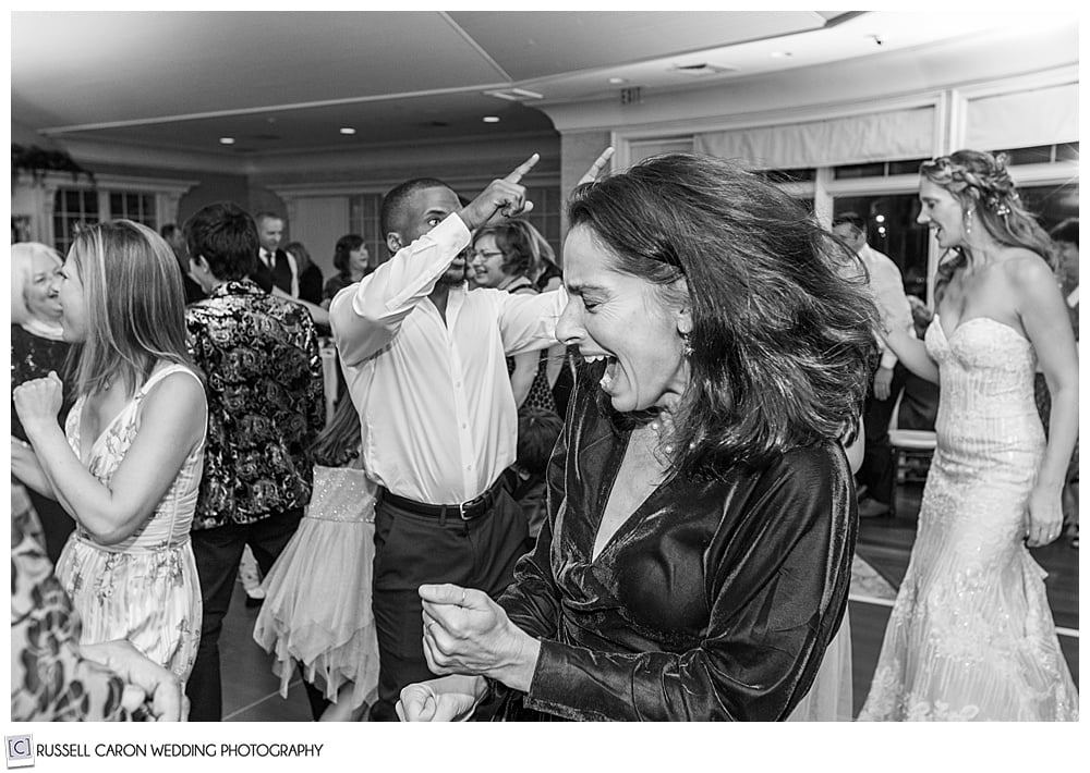 black and white photo of guests dancing at a midcoast maine wedding reception