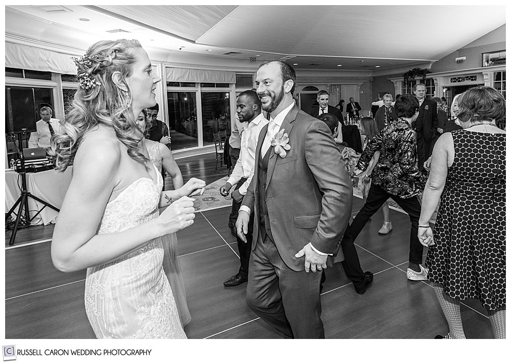 black and white photo of bride and groom dancing at their midcoast maine wedding reception