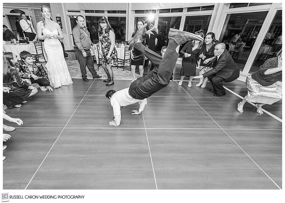 wedding guest dancing the worm at a midcoast maine wedding reception