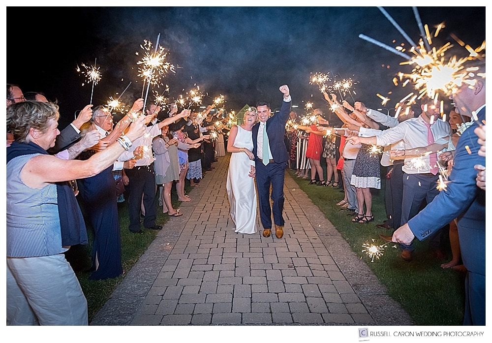 Bride and groom having fun during a sparkler exit at the Bar Harbor Club, Bar Harbor, Maine. Sparkler exits are so much fun!