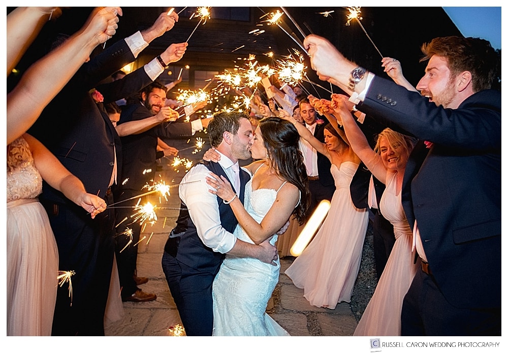 Bride and groom during sparkler exits. Wedding sparkler exits, how to have a great one!