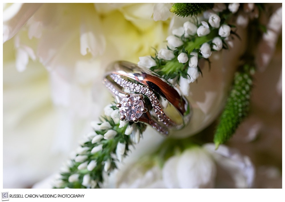 wedding ring detail photo with flowers