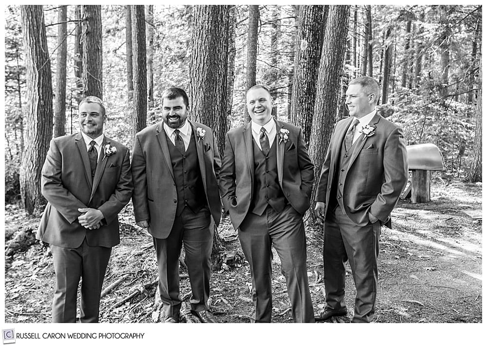 black and white photo of the groom with his groomsmen
