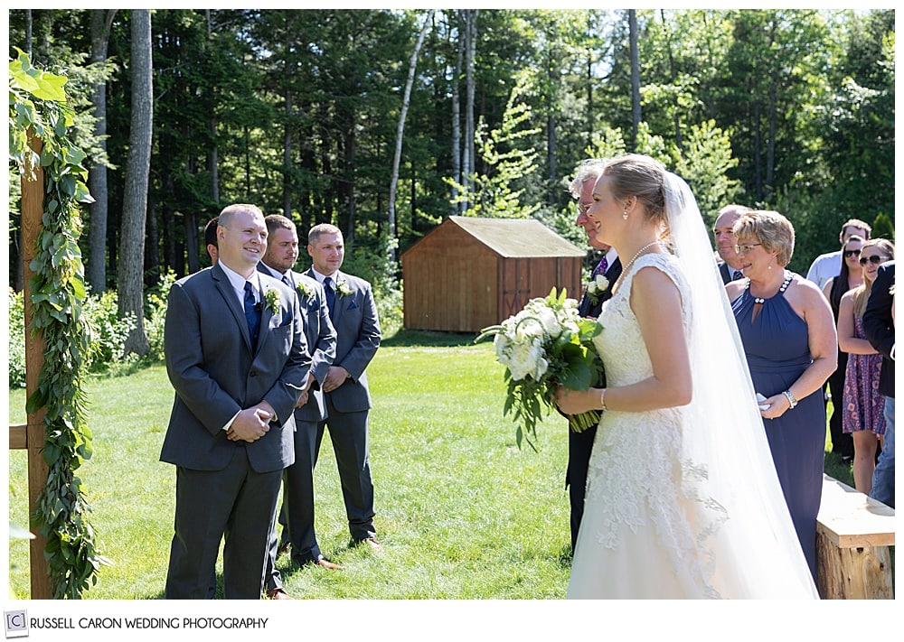 bride and her father reach the groom at a Moose Lake Ranch wedding