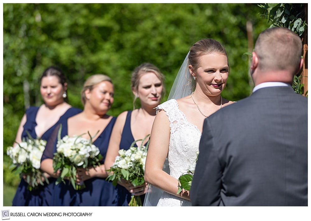 bride and bridesmaids during an outdoor Moose Lake Ranch wedding ceremony