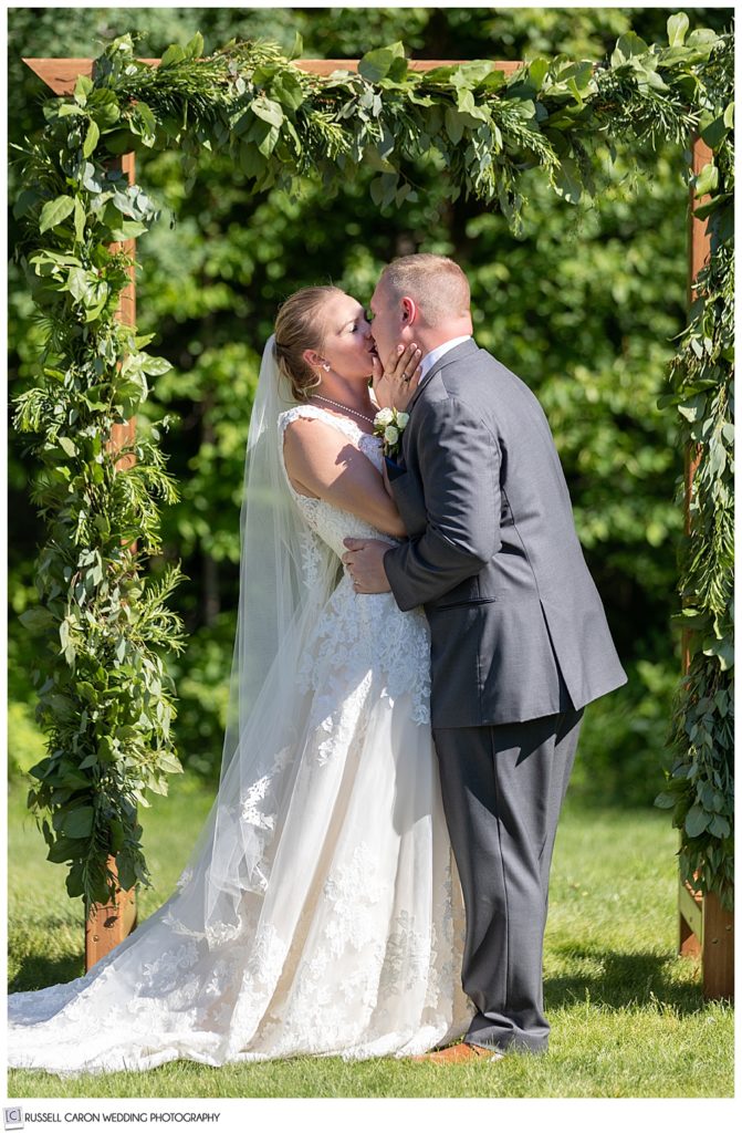 bride and groom during first kiss