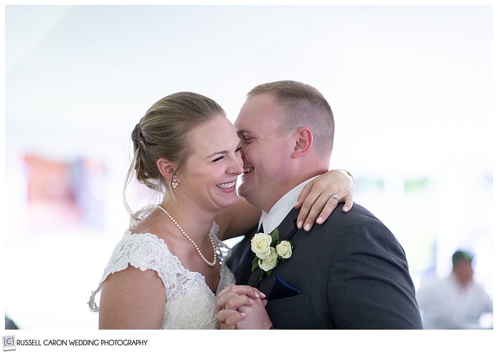 bride and groom dancing and laughing