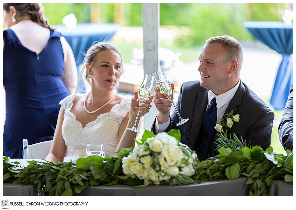 bride and groom toasting with champagne