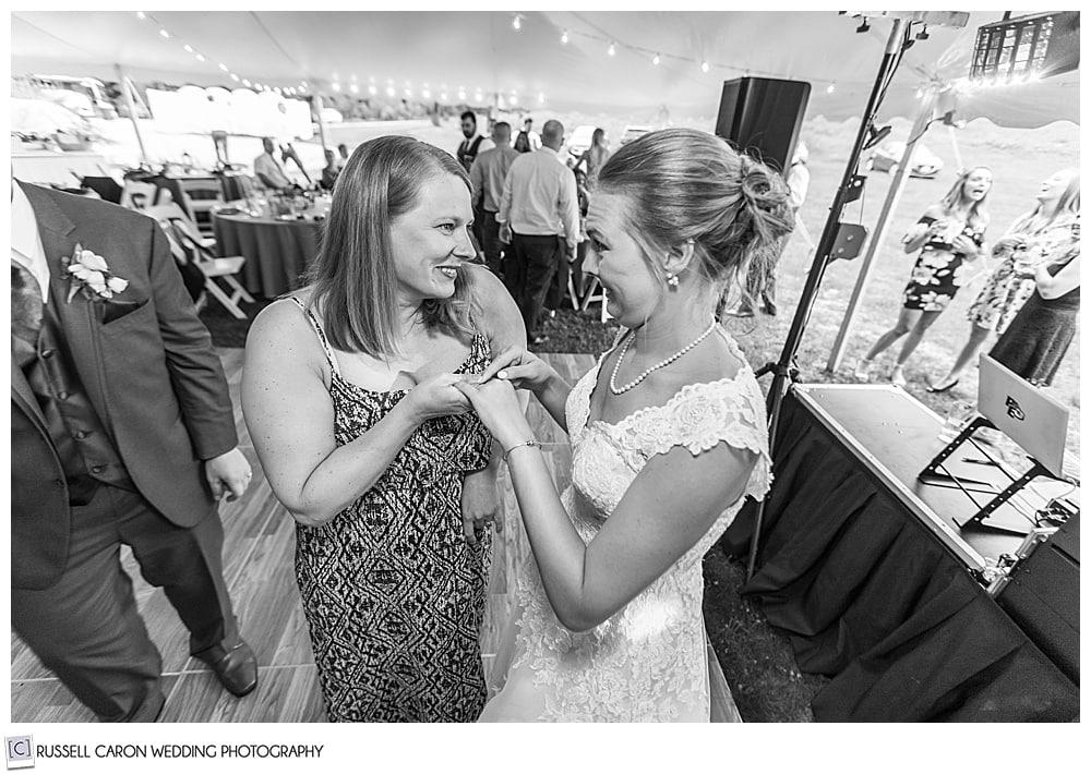 black and white photo of bride talking to a woman