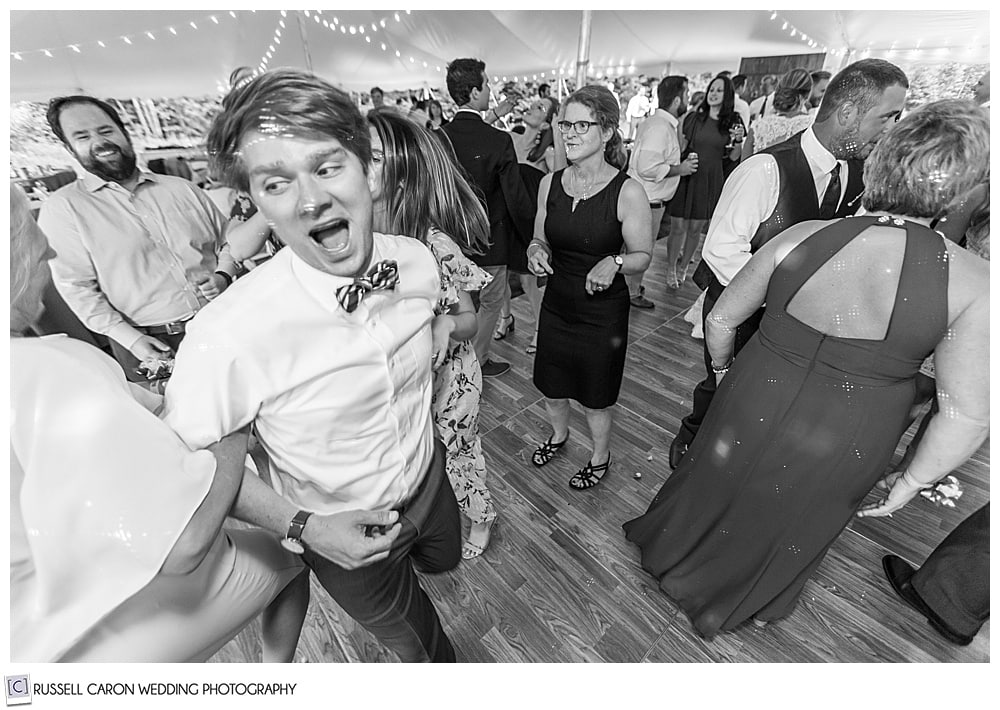 black and white photo of man on a dance floor