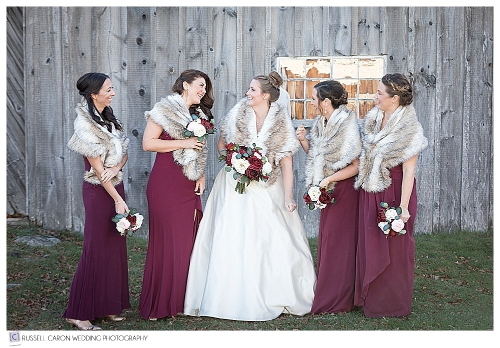 bride and bridesmaids wearing faux fur stoles