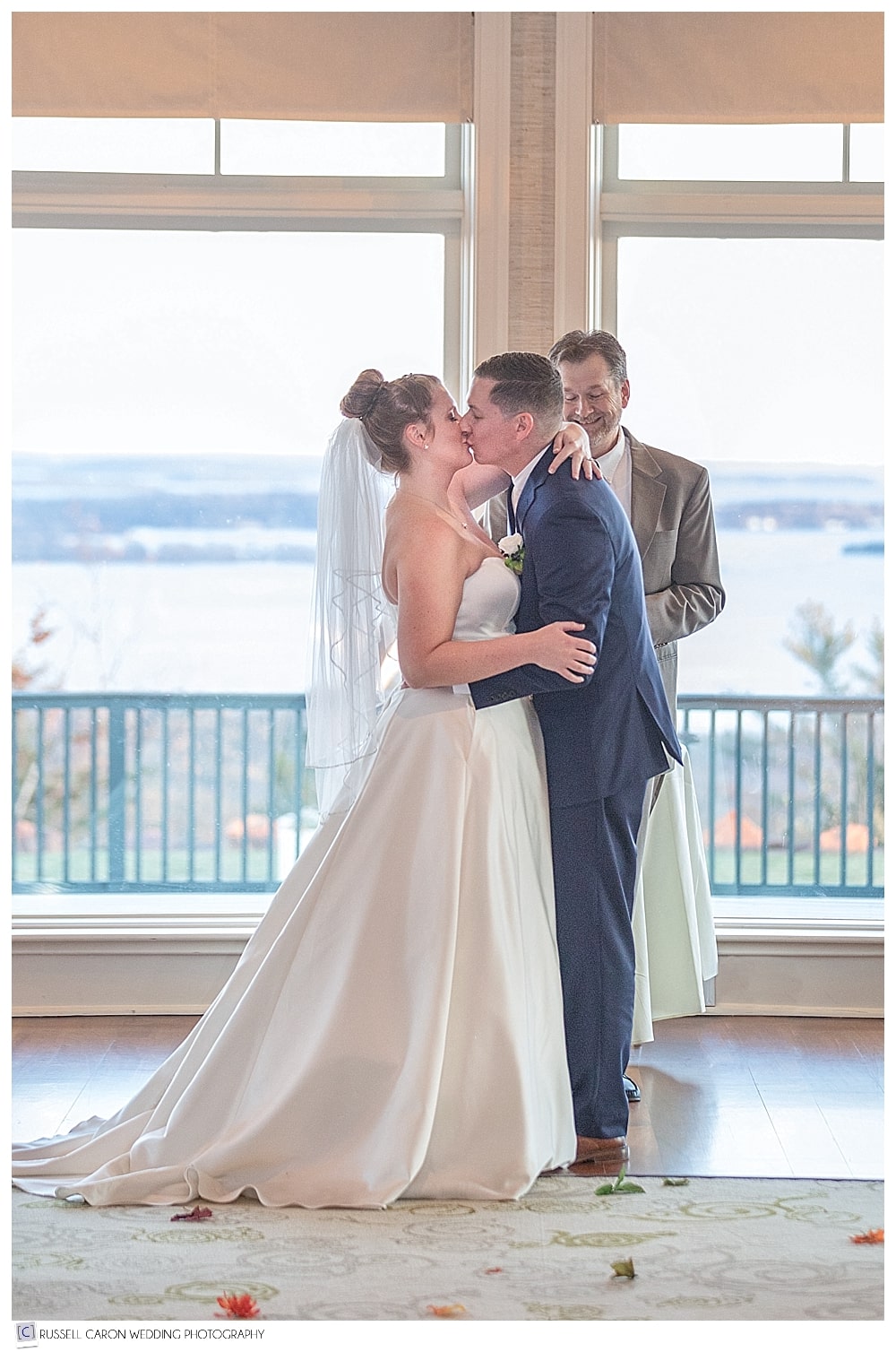 bride and groom's first kiss at Point Lookout Northport Maine wedding