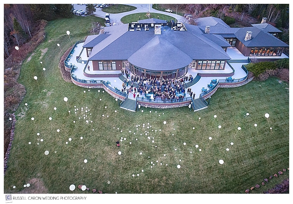 Maine drone wedding photographer takes photo of wedding day balloon release at Point Lookout Northport Maine weddings