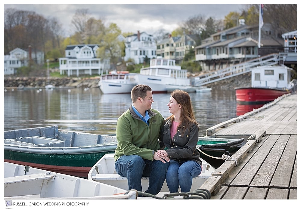 Couple sitting in a dinghy in Perkins Cove Maine
