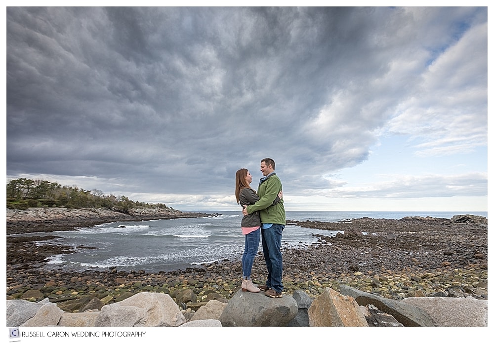 couple standing on rocks in Ogunquit Maine