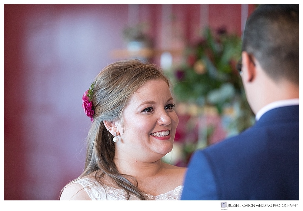 bride smiles during wedding ceremony