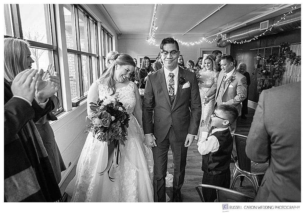bride and groom during wedding recessional
