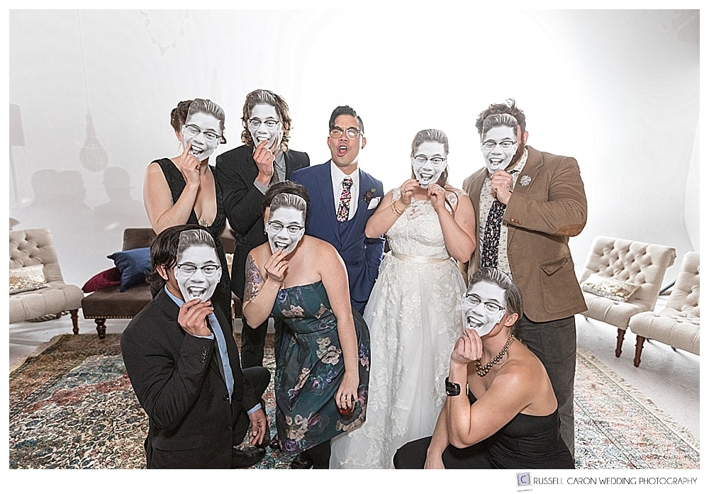 Wedding guests wearing groom masks