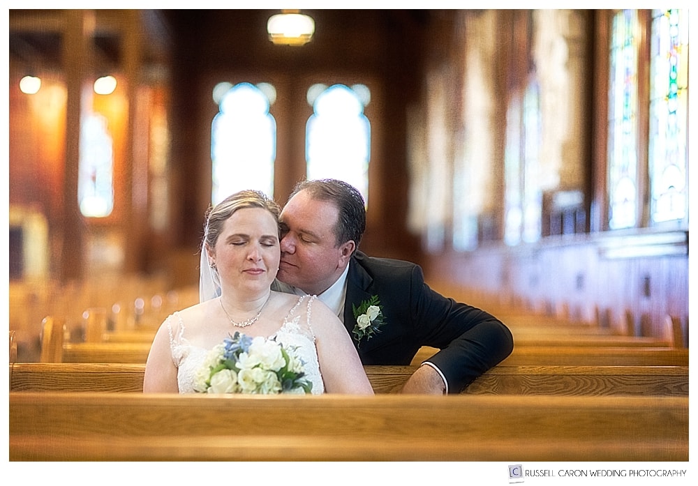 bride and groom sitting in the church