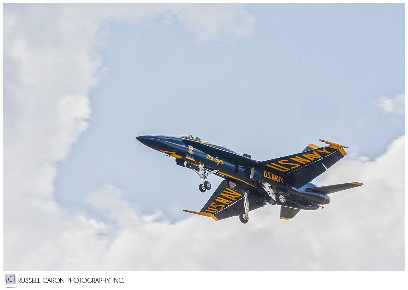 A solo US Navy Blue Angel preparing to land