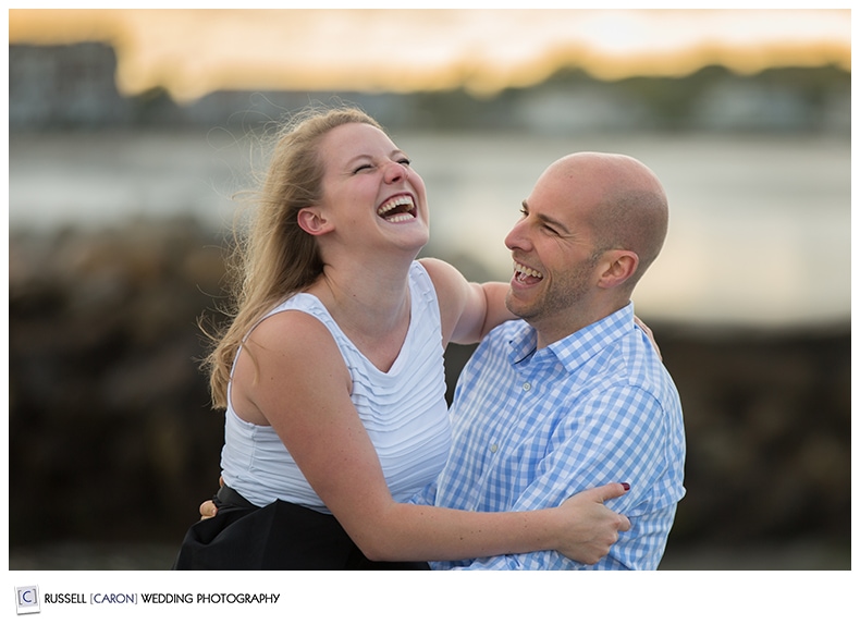 Couple laughing during Kennebunkport Maine engagement photography