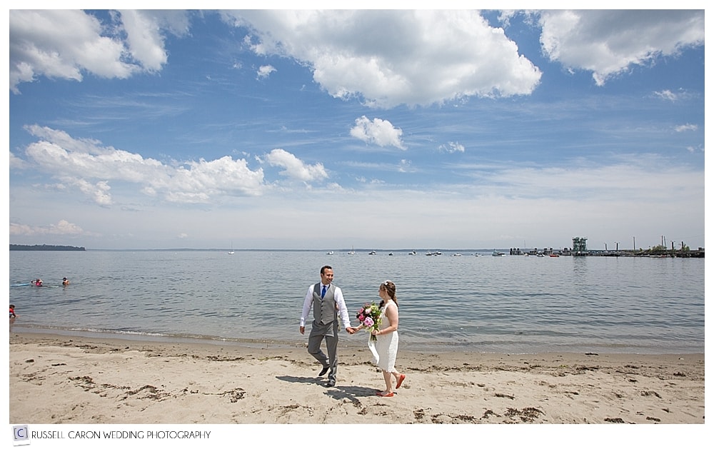 bride-and-groom-walking-at-lincolnville-beach-maine