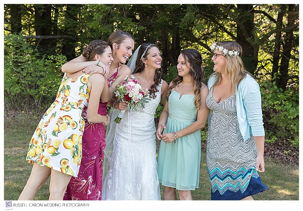 bride laughing with bridesmaids
