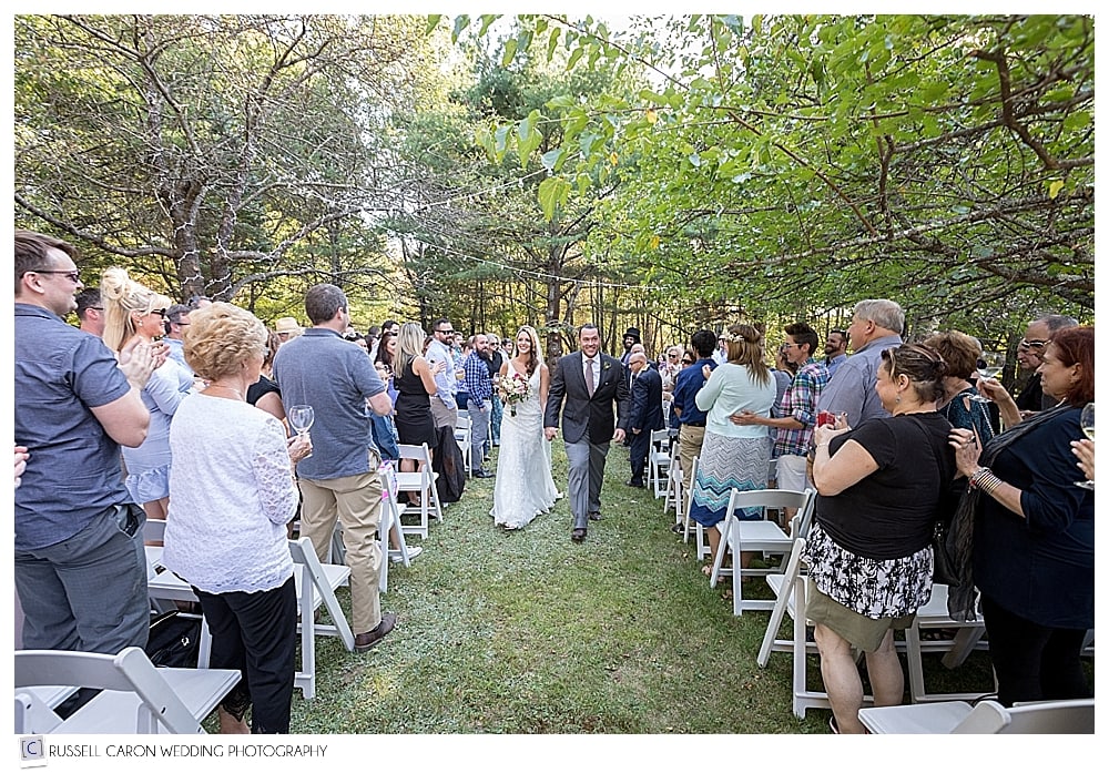 bride and groom during recessional at outdoor wedding