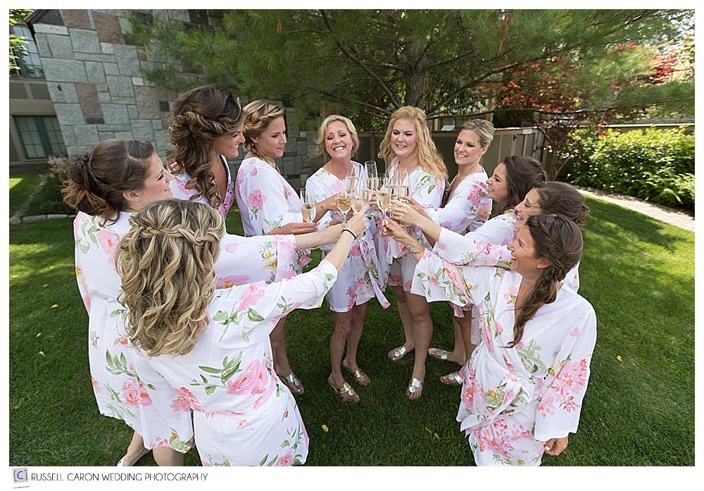 Bride and bridesmaids champagne toast in robes
