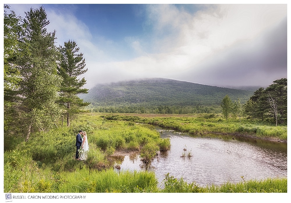 Bride and groom beside a stream in Acadia National Park, Bar Harbor, Maine