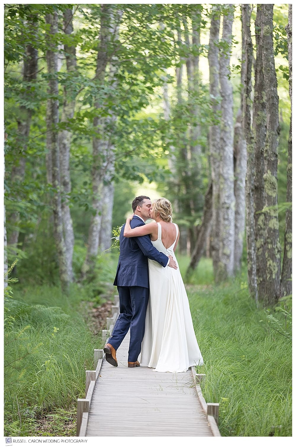 Bride and groom kissing on the Jesup Trail in Acadia National Park, by Acadia National Park photographers