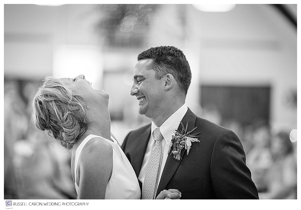 Bride and groom laughing during the first dance