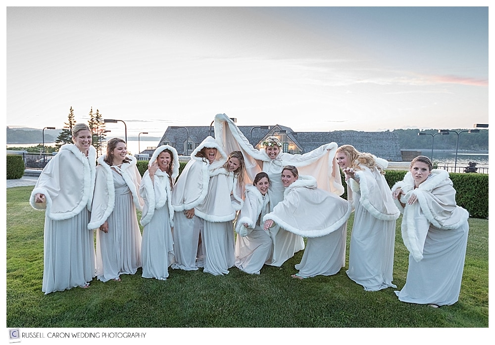 Bride and bridesmaids with ivory cloaks 