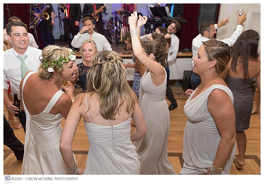 Bride and bridesmaids dancing