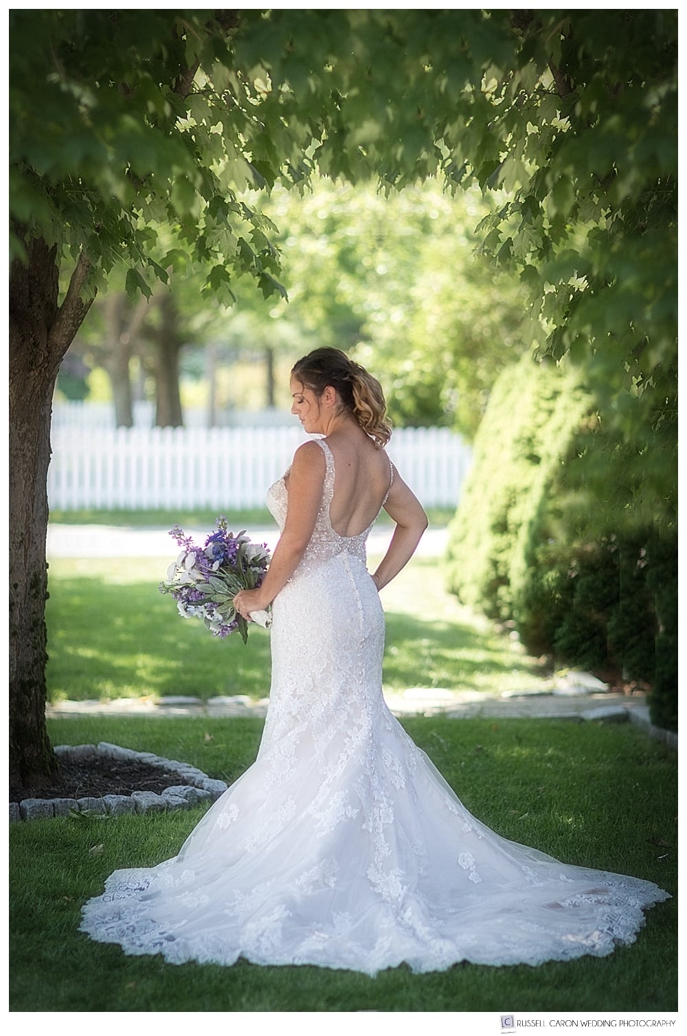 bridal portrait of the back of the bride's Allure Bridals gown