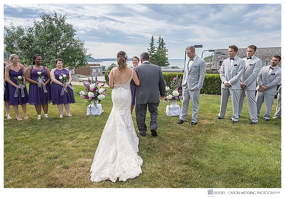 bride and her father walk towards the groom, in an outdoor wedding ceremony at the Bar Harbor Club, Bar Harbor, Maine.