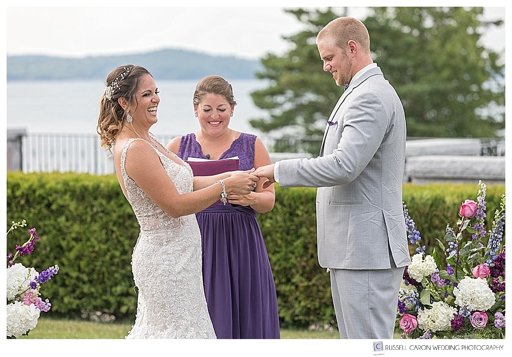 bride and groom laughing during their outdoor wedding ceremony. Bar Harbor Maine wedding photographer